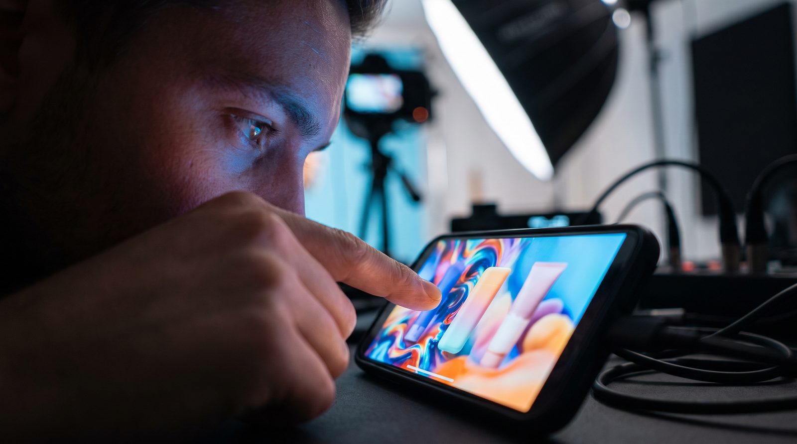 Creative professional reviewing a video ad on a smartphone